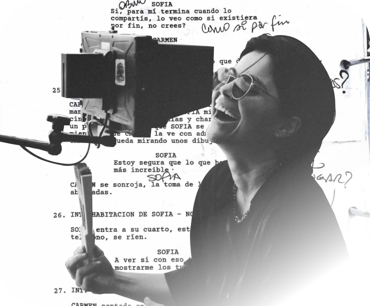 A director laughs behind a field monitor, over a page of handwritten script notes